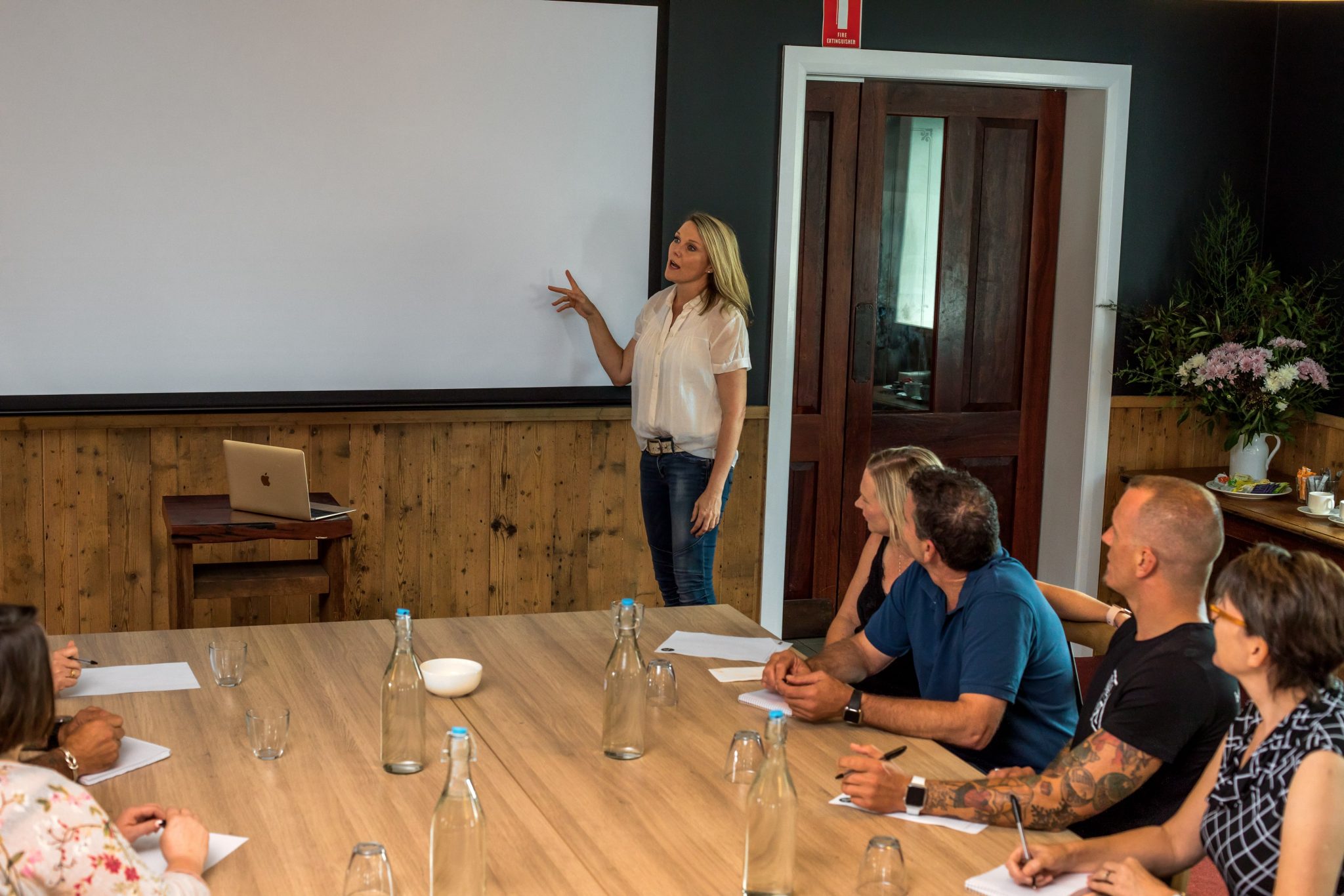 The Mountain View Room at The Victoria Hotel Woodend - Spacious, modern event room set up with tables, chairs, and presentation equipment, showcasing a flexible layout suitable for meetings, training, conferences, and large events.